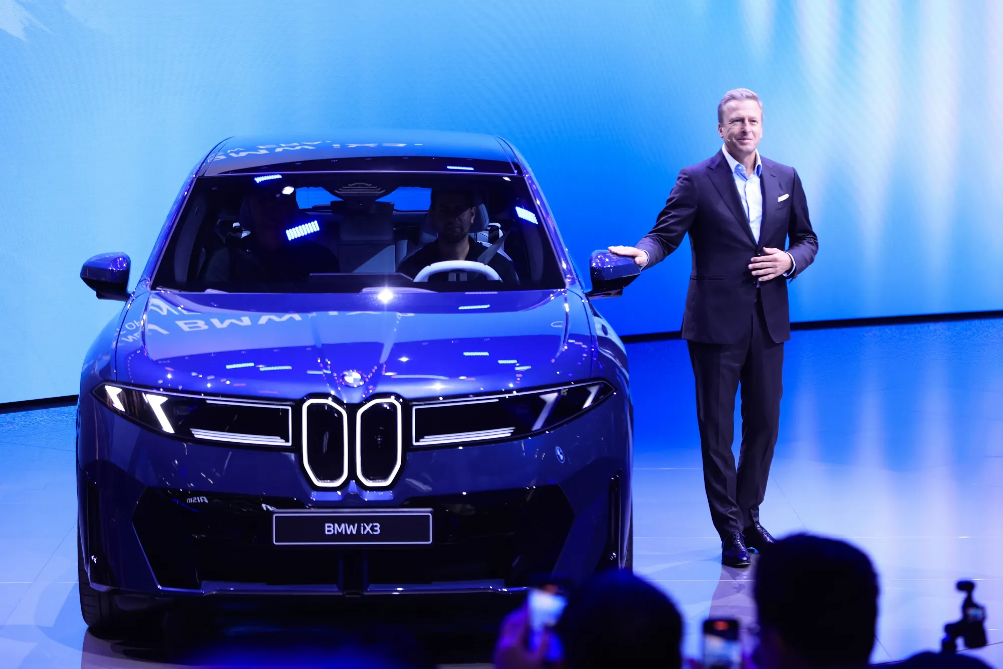 Oliver Zipse with a BMW iX3 Neue Klasse vehicle at the IAA Mobility 2025 expo in Munich, Germany, on Sept. 8.