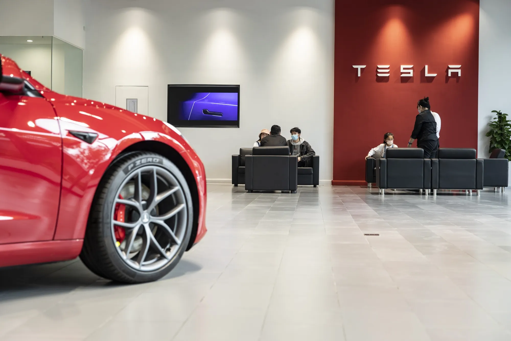 Customers at a Tesla showroom in Shanghai.