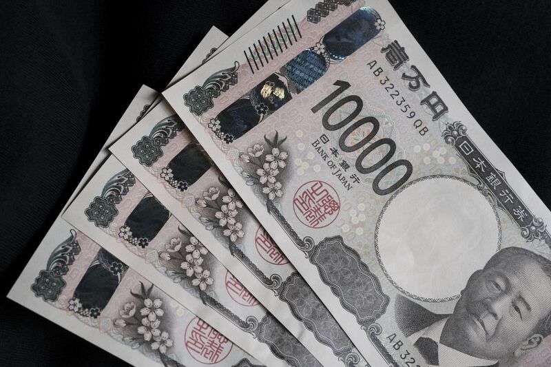 Japanese 10,000 yen banknotes arranged for a photograph in Tokyo, Japan. 