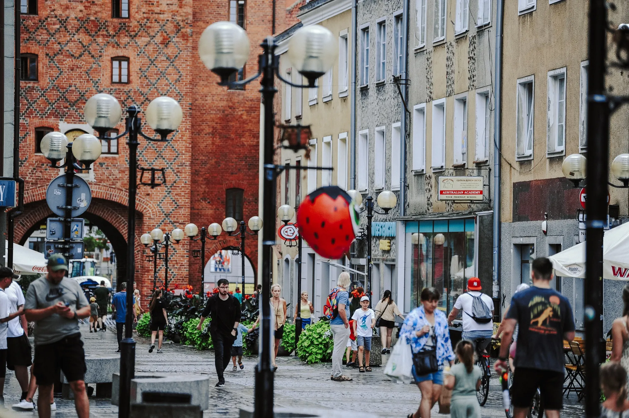 Pedestrians and shoppers in the old town of Olsztyn, Poland.