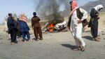 This photograph taken on May 21, 2016 shows Pakistani local residents gathering around a destroyed vehicle hit by a drone strike in which Afghan Taliban Chief Mullah Akhtar Mansour was believed to be travelling in the remote town of Ahmad Wal in Balochistan, around 160 kilometres west of Quetta. Afghan authorities scrambled May 22 to confirm the fate of Taliban leader Mullah Akhtar Mansour after US officials said he was likely killed in drone strikes -- a potential blow to the resurgent militant movement. / AFP / - (Photo credit should read -/AFP/Getty Images)
