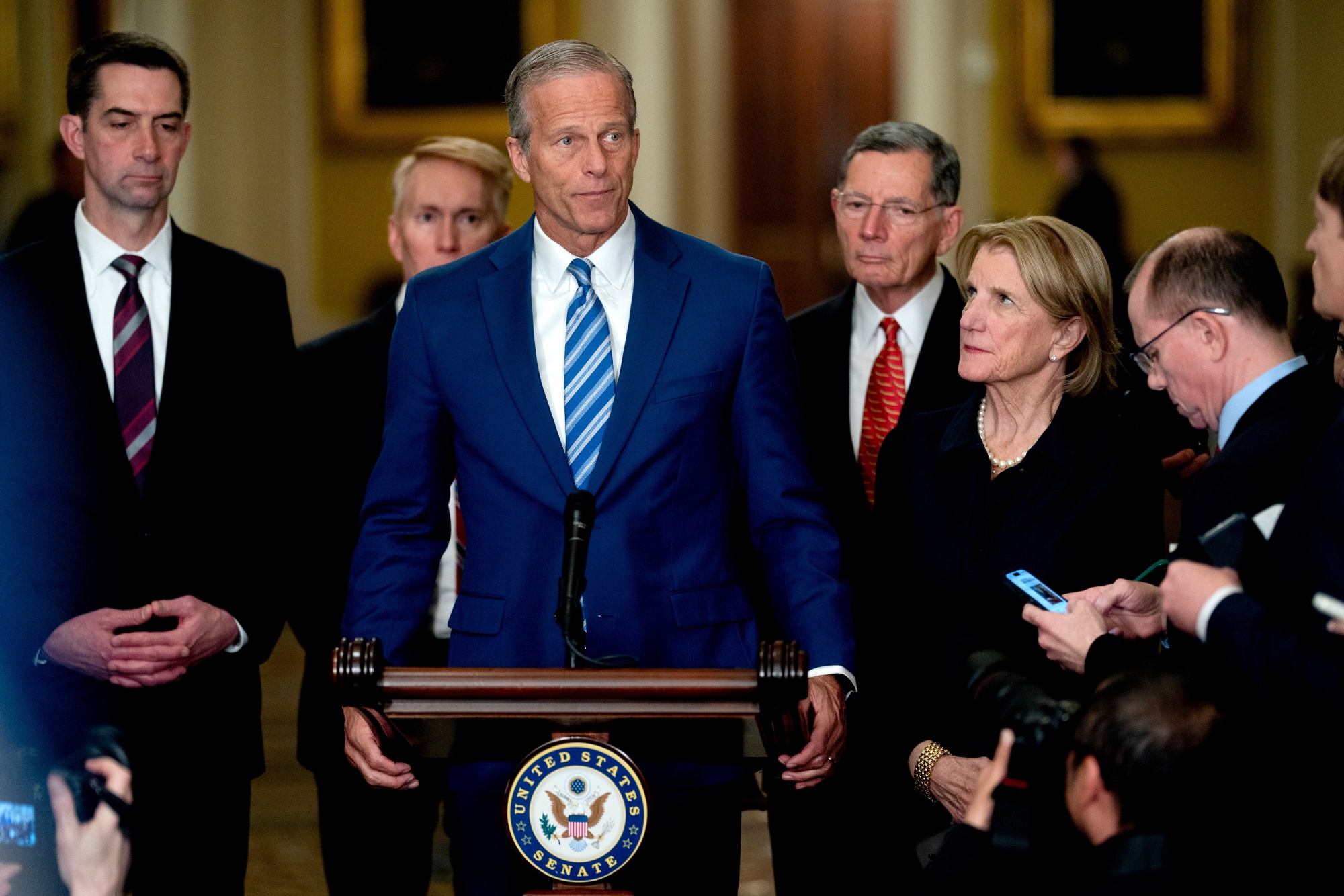 Senator Tom Cotton, a Republican from Arkansas, from left, Senator James Lankford, a Republican of Oklahoma, Senate Majority Leader John Thune, a Republican from South Dakota, Senator John Barrasso, a Republican from Wyoming, and Senator Shelley Moore Capito, a Republican from West Virginia, during a news conference following the weekly Senate Republican policy luncheon at the US Capitol in Washington, DC, US, on Tuesday, March 24, 2026. Senate Minority Leader Chuck Schumer said the Democrats have received Republicans’ latest proposal to fund the Department of Homeland Security, and that they will be sending a counteroffer that contains “significant reform in it.” Photographer: Stefani Reynolds/Bloomberg