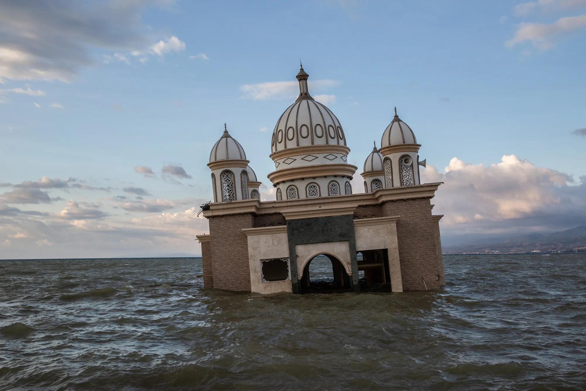 Water surrounds a mosque following the tsunami in Palu, Central Sulawesi.