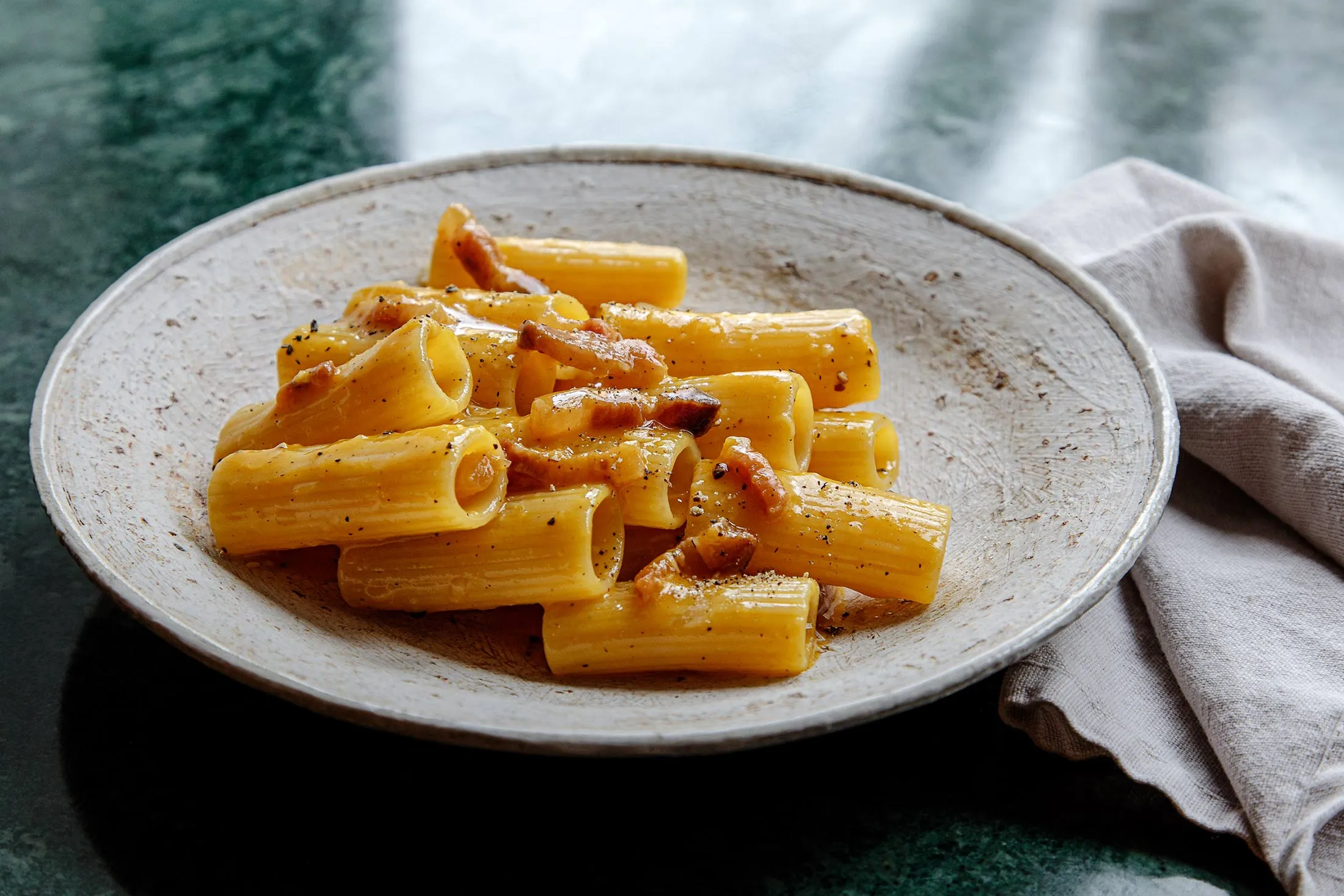 Pasta carbonara benefits from smoked mushroom garum.