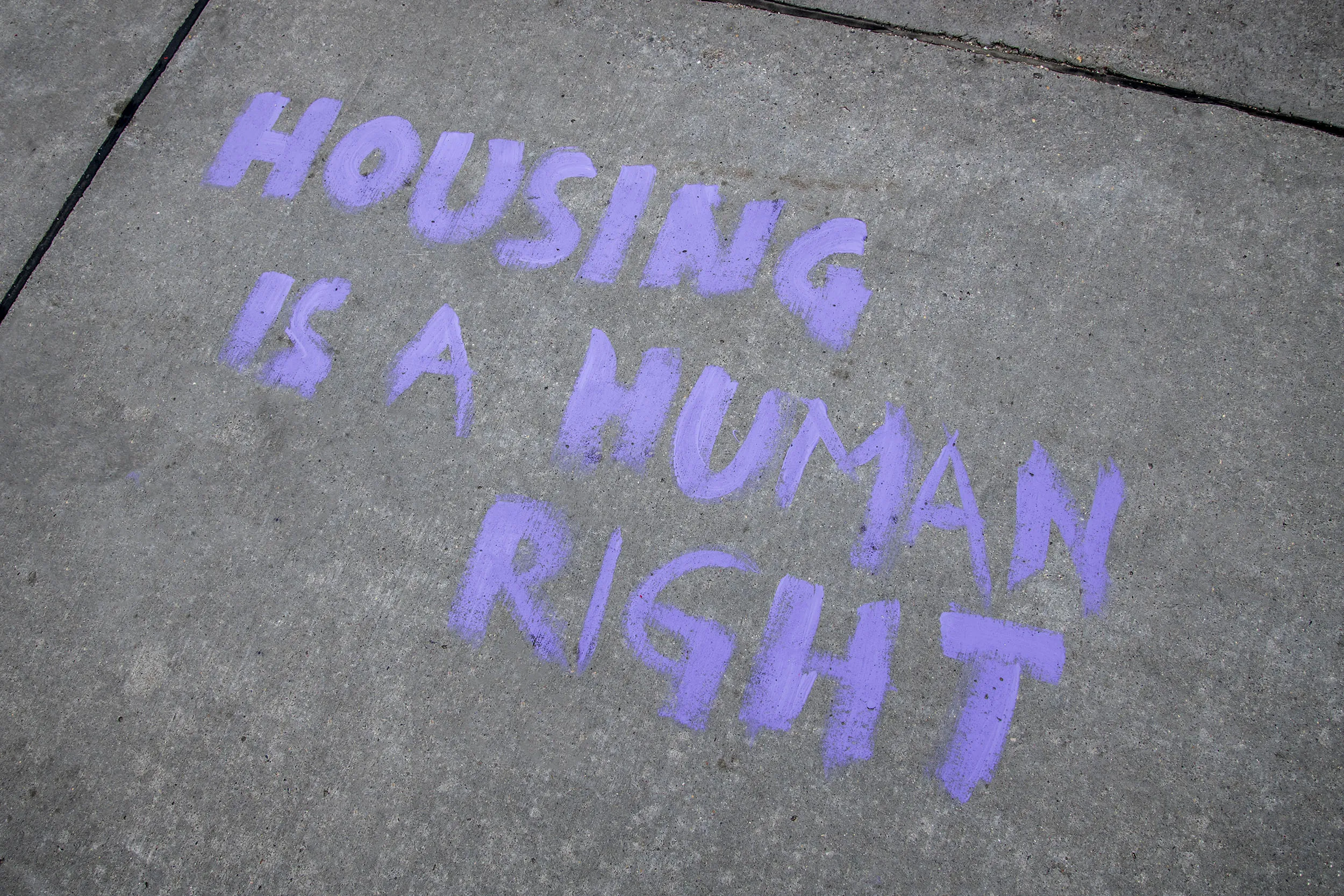 Graffiti made during a protest in May, in Minnesota, calling for an end to housing evictions during the pandemic.