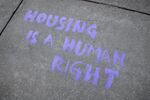 Graffiti made during a protest in May, in Minnesota, calling for an end to housing evictions during the pandemic.