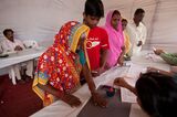 Polling official mark voters finger ink, Mumbai, Maharashtra, India, Asia