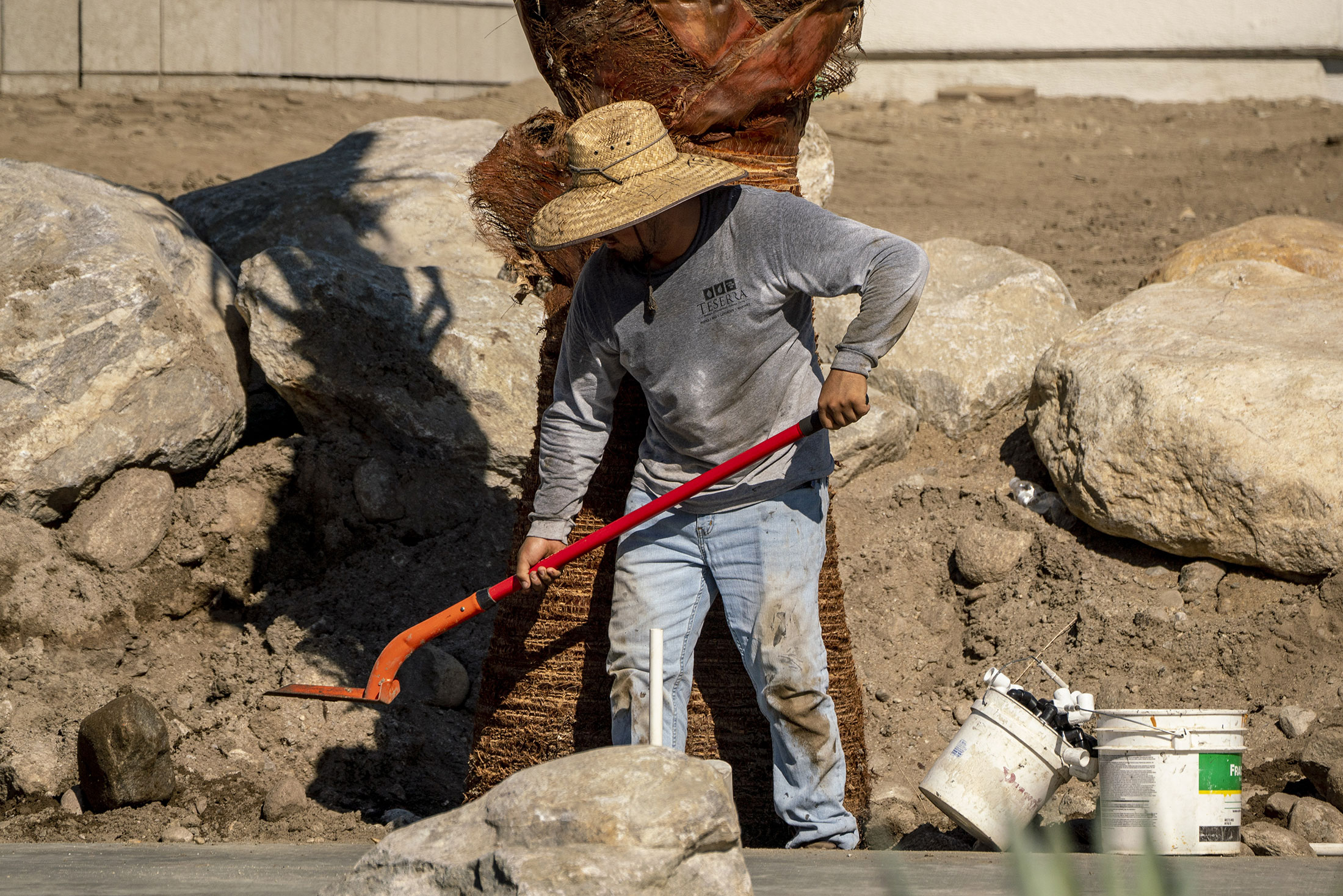 A contractor works on a new apartment construction during a heatwave in Palm Springs, California, US, on Friday, July 14, 2023.