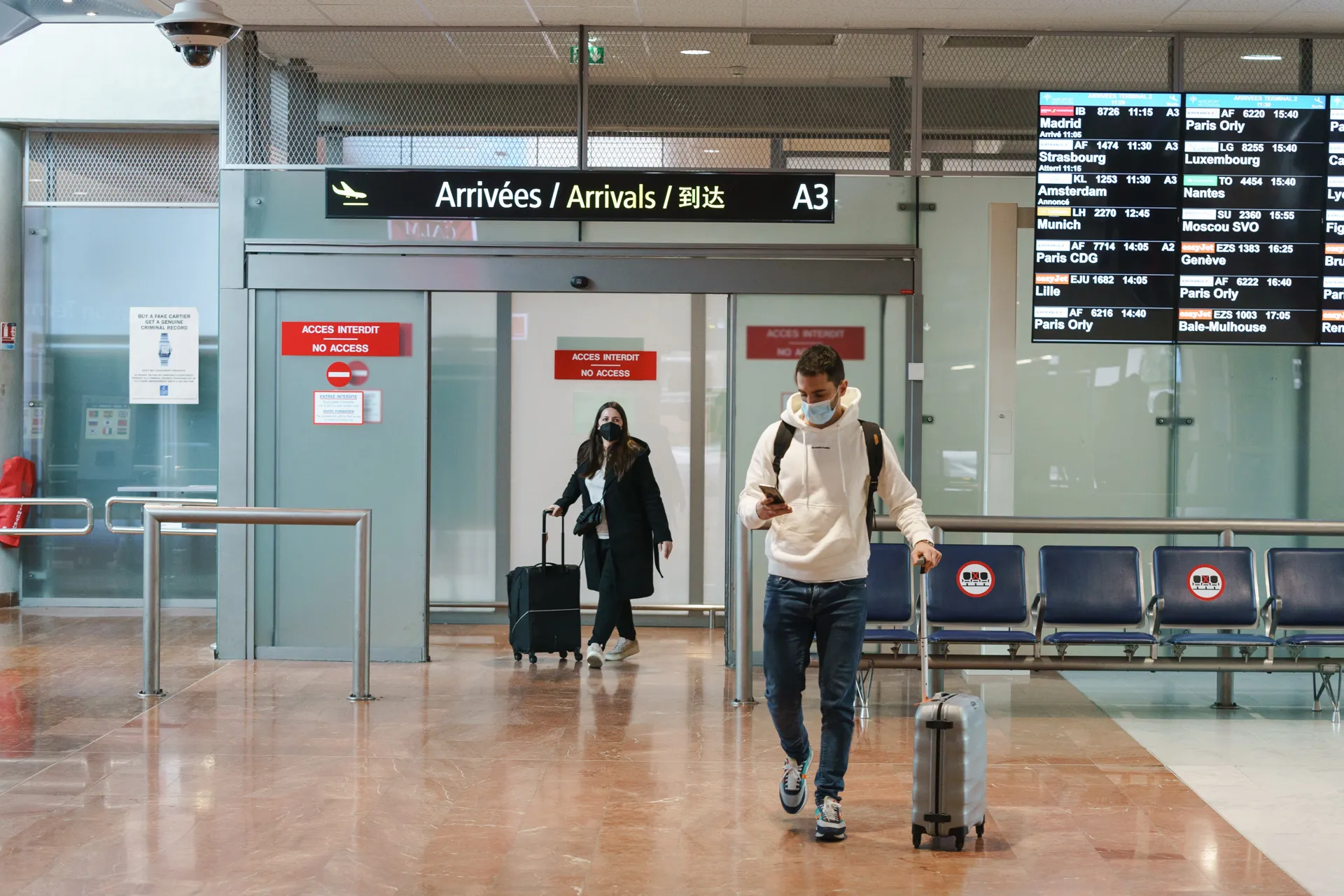 Passengers make their way into the arrivals area at Nice Cote d'Azur Airport.