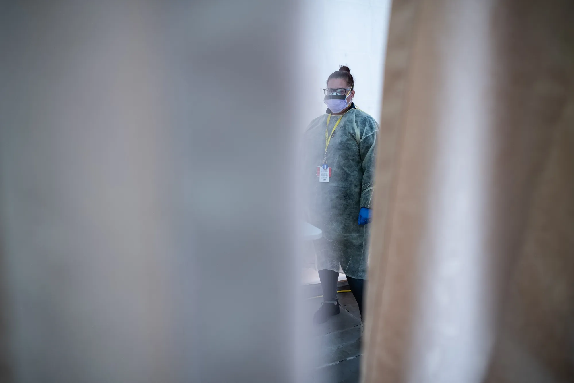 A doctor stands inside a testing tent at St. Barnabas hospital on March 20, 2020 in New York City.