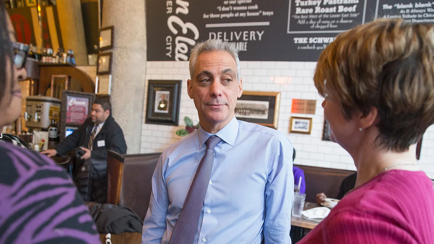 Chicago Mayor Rahm Emanuel greets residents inside a restaurant during a lunch stop on election day February 24, 2015 in Chicago, Illinois.

