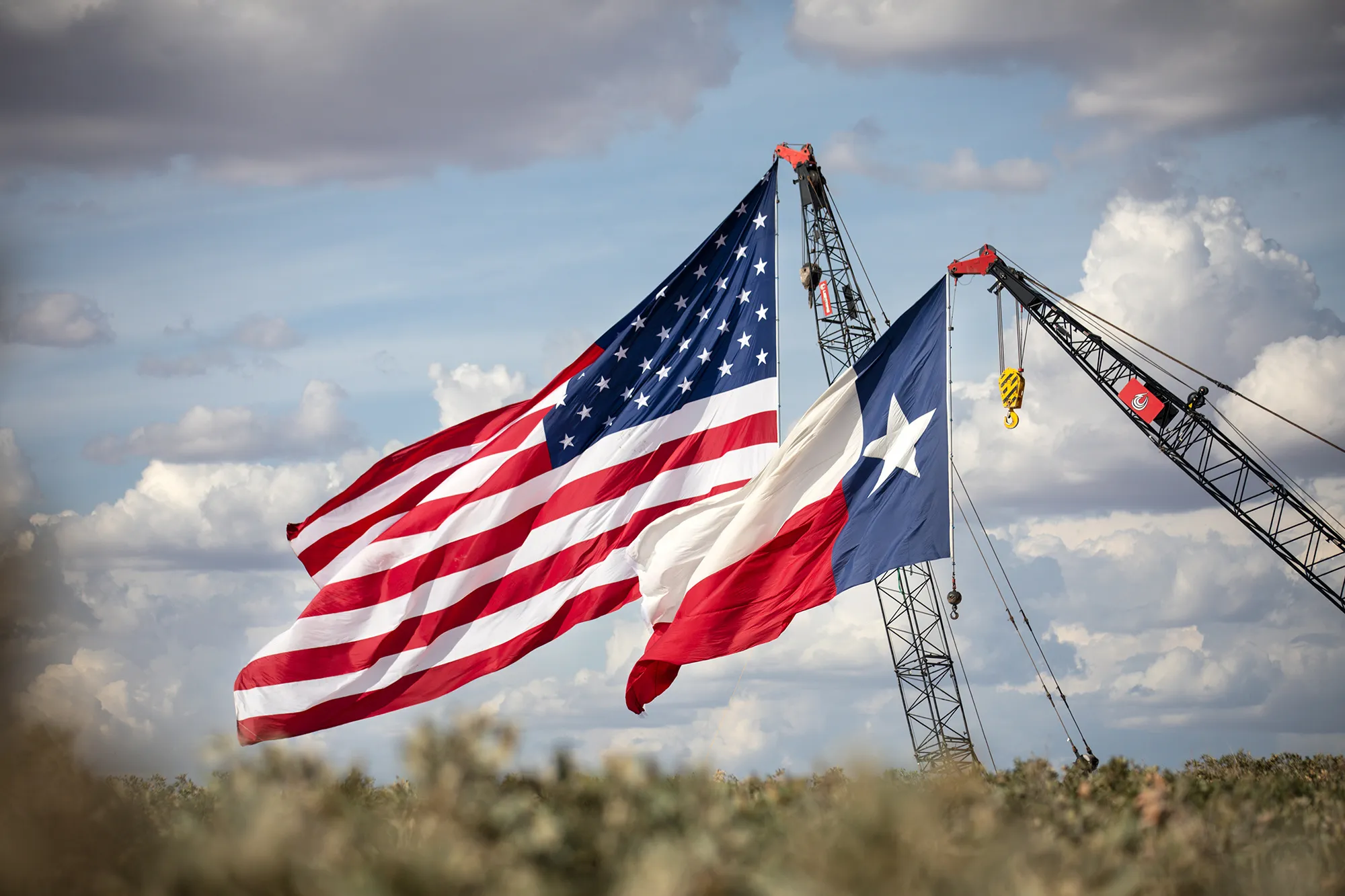 The American and Texas flags raised at a Double Eagle Energy rig in Midland, Texas, on July 28.