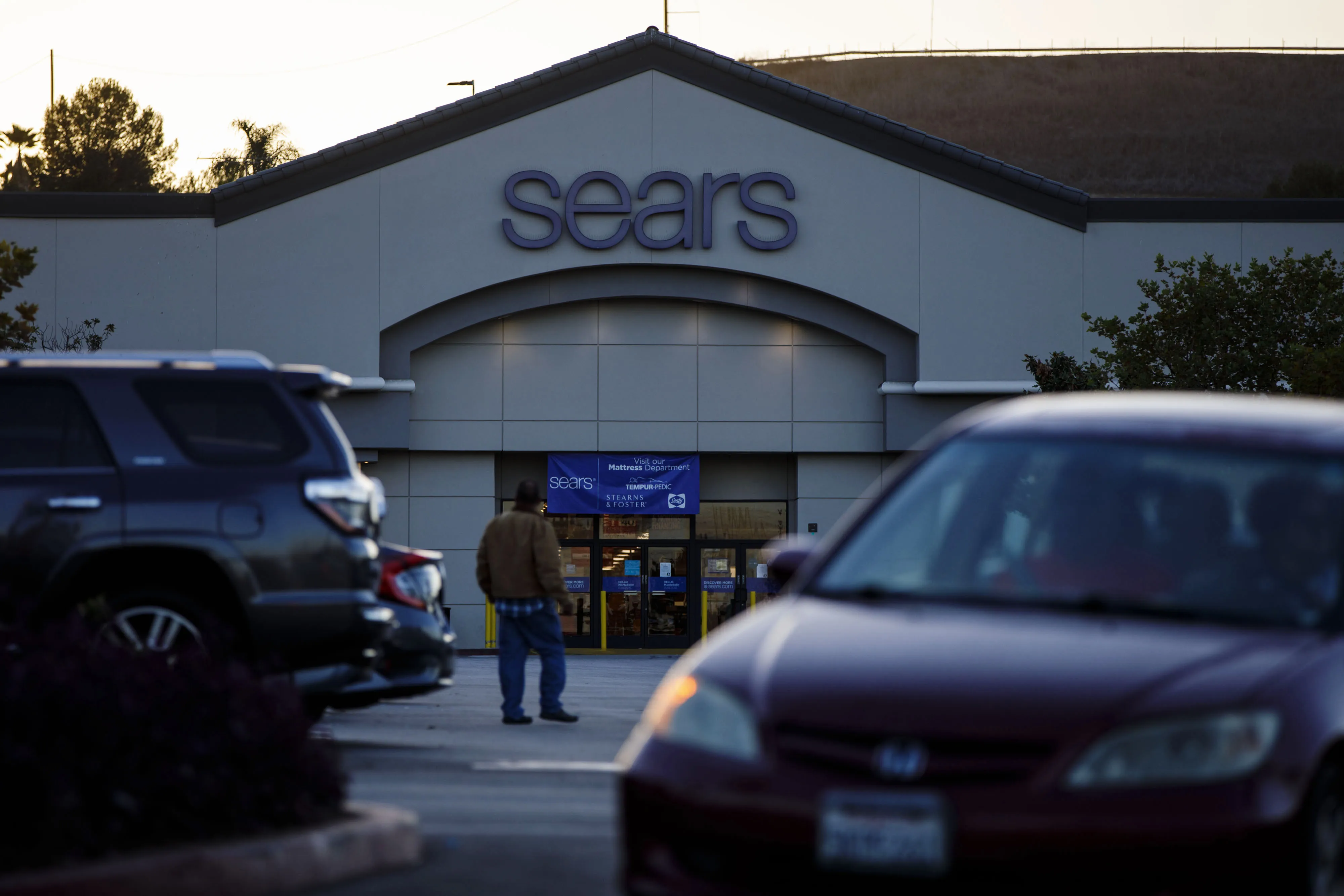 Shoppers walk outside of a Sears Holdings Corp. store in Montebello, California, on&nbsp;Oct. 10, 2018.