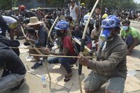 Protesters confront police in Thaketa township Yangon, March 27. 