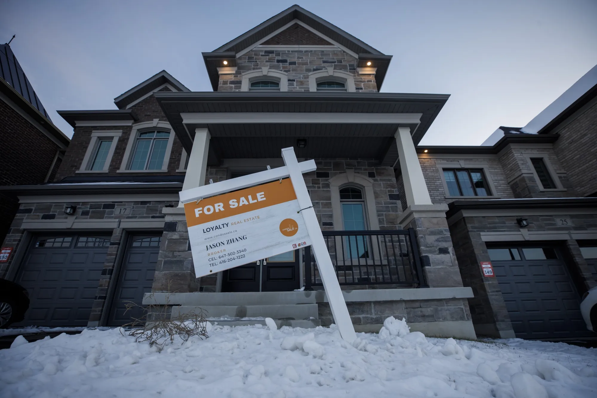 A "For Sale" sign outside a home in Vaughan, Canada.