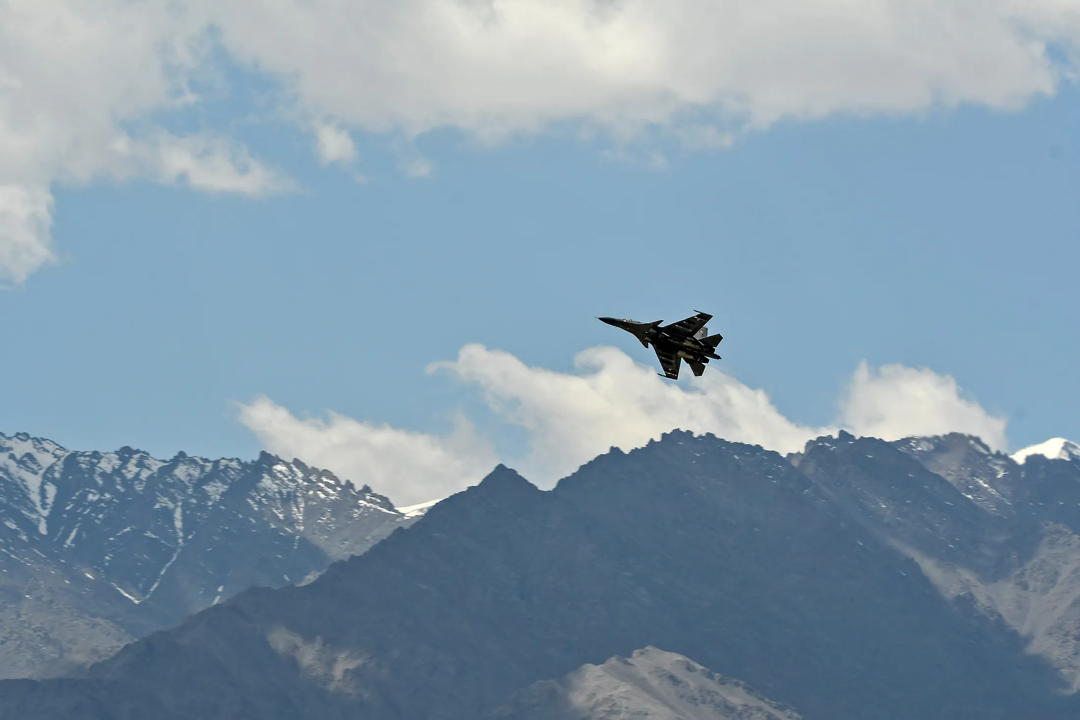 An Indian Air Force aircraft is seen against the backdrop of mountains surrounding Leh, the joint capital of the union territory of Ladakh, on June 27.