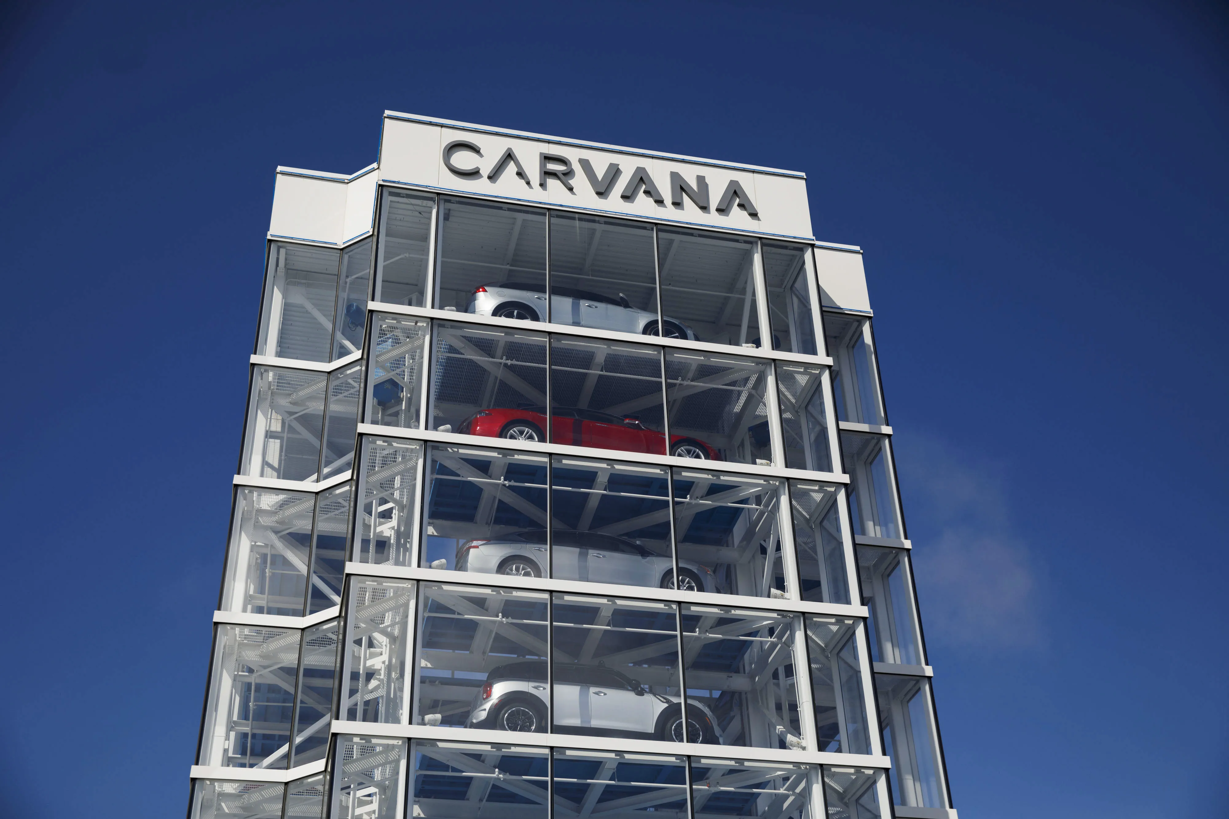 Vehicles sit inside a Carvana&nbsp;car vending machine in Westminster, California.