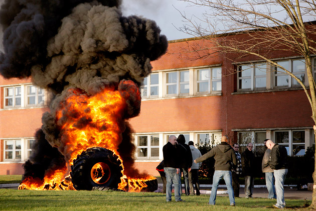 Workers igniting a bonfire of tires in front of the Goodyear plant in Amiens, France, on Jan. 7