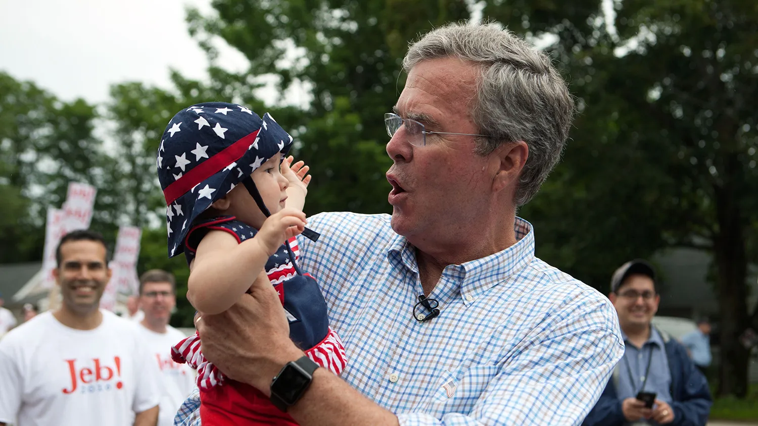 Republican Presidential candidate Jeb Bush greets supporters at the 4th of July Parade in Merrimack, New Hampshire.
