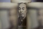 Japanese 10,000 yen banknotes are arranged for a photograph in Tokyo, Japan.
