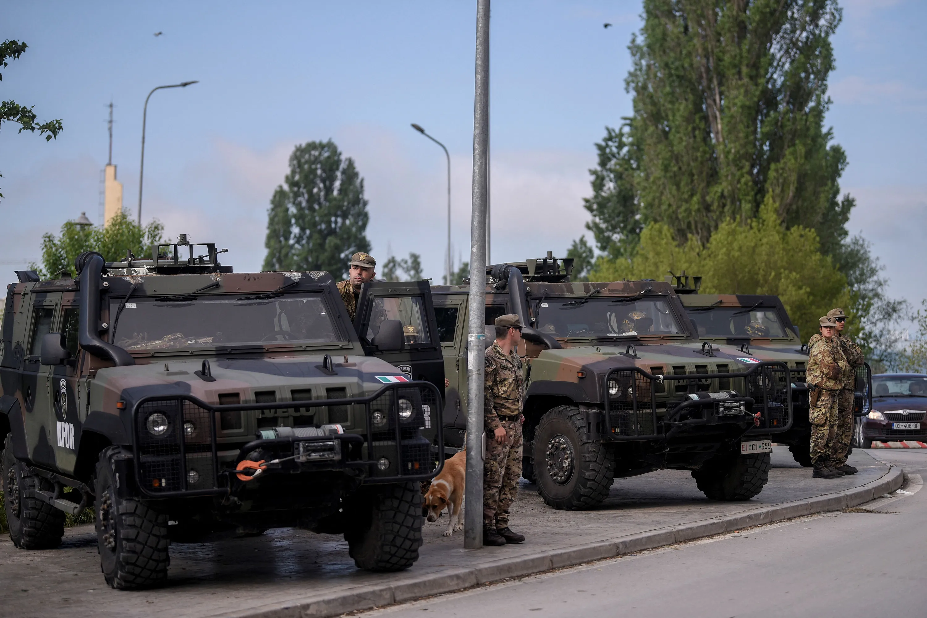 NATO soldiers stand guard yesterday&nbsp;in the town of Mitrovica, Kosovo.