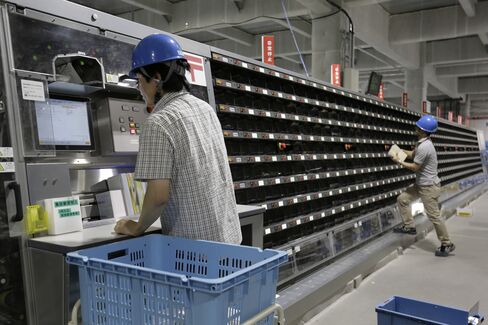 Japan Post employees sort mail