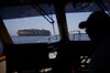 The captain of a port pilot boat approaches the APL Danube container ship outside the Port of Los Angeles in Los Angeles, California, U.S., on Wednesday, March 28, 2018. Long-only exchange-traded funds (ETFs) linked to broad baskets of energy, metals and agricultural products attracted $2.66 billion this quarter, Bloomberg Intelligence estimates show. While that's the largest quarterly inflow in data going back to 2005, the stream of money slowed in March as the U.S.-China trade row clouded the outlook for economic growth.