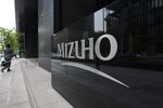 The Mizuho Financial Group Inc. headquarters in Tokyo. Photographer: Tomohiro Ohsumi/Bloomberg