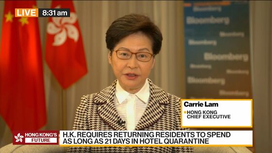 Carrie Lam Defends Hong Kong Covid Curbs as Singapore Opens