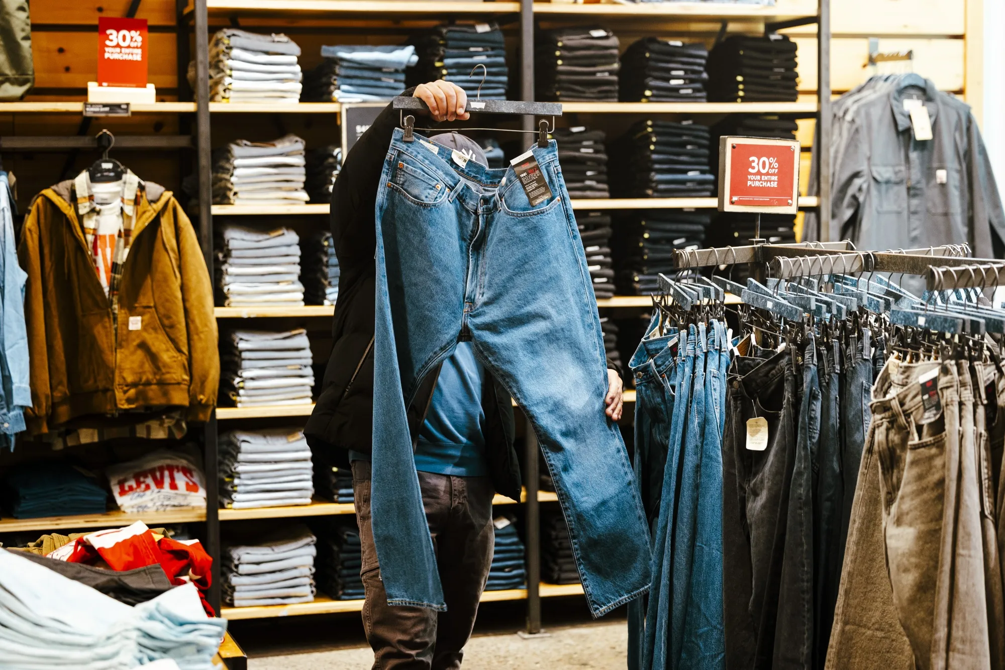 A shopper looks at jeans inside a Levi’s store in New York.