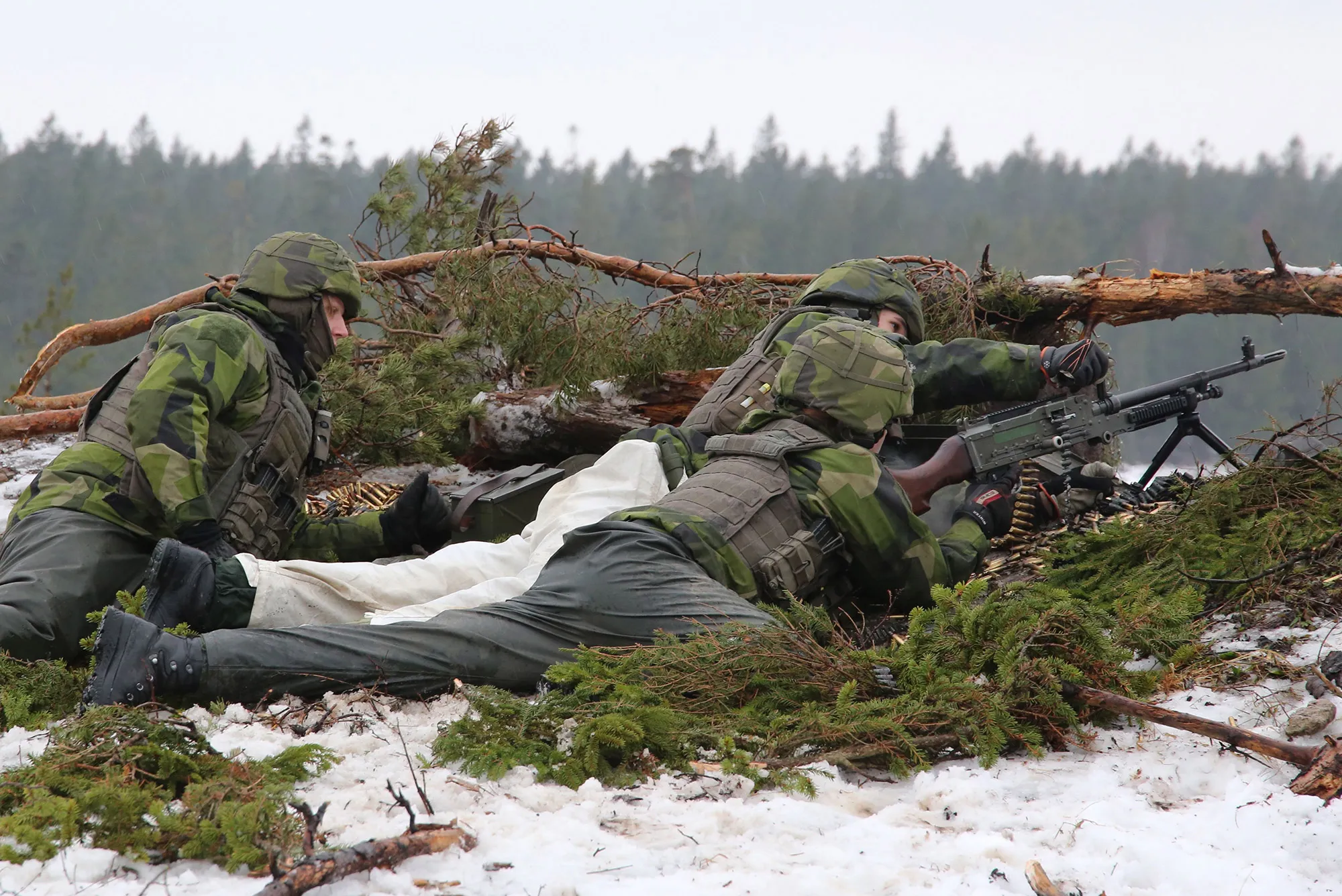 Swedish Army's Gotland regiment load a machine gun on a range on the island of Gotland.&nbsp;
