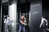 Pedestrians walk past an entrance to the Sony Corp. office in Tokyo, Japan, on Wednesday, Sept. 18, 2019. Sony plans to hold on to its semiconductor and financial services operations, rebuffing a series of proposals from American activist investor Dan Loeb.