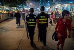 Police patrolling in a night food market near the Id Kah Mosque in Kashgar in China's Xinjiang Uighur Autonomous Region, in 2017.