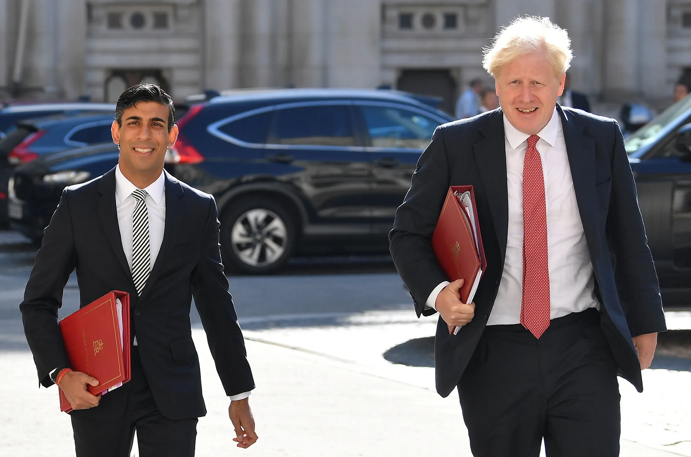 Rishi Sunak, left, and Boris Johnson arrive to attend a Cabinet meeting of senior government ministers at the Foreign and Commonwealth Office in London on Sept. 1.