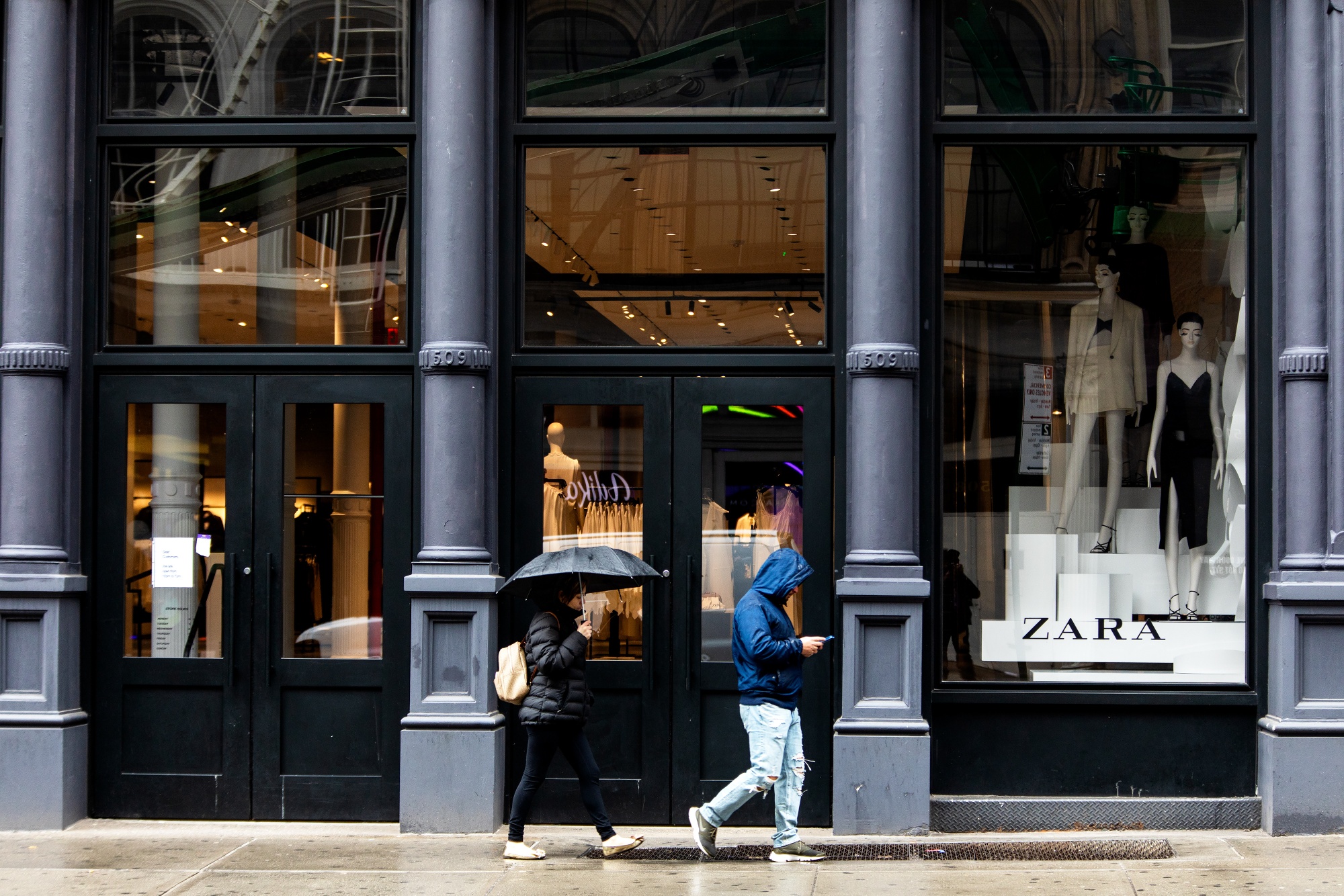 Pedestrians pass a Zara store in&nbsp;New York, on March 17.