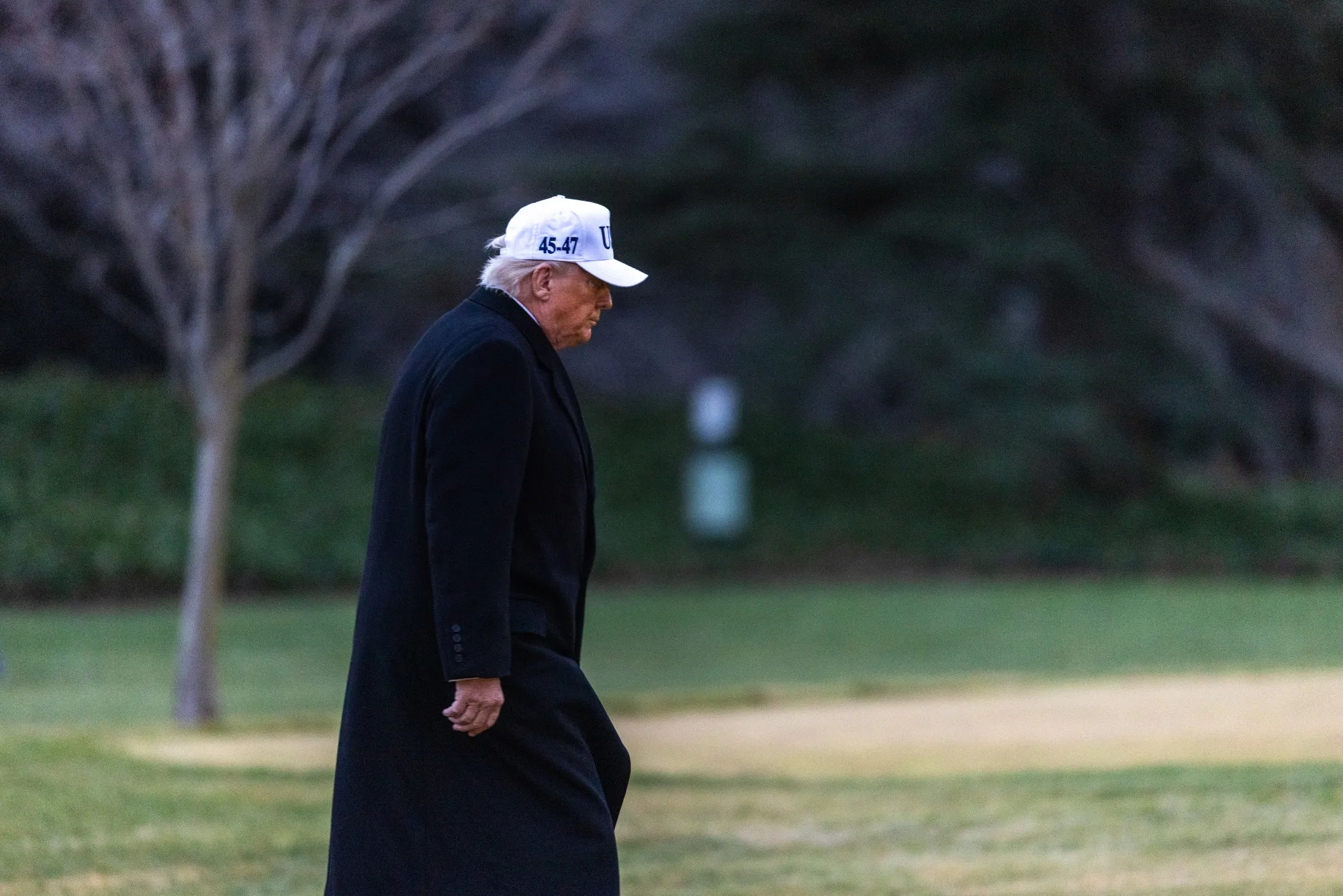 US President Donald Trump walks on the South Lawn of the White House.