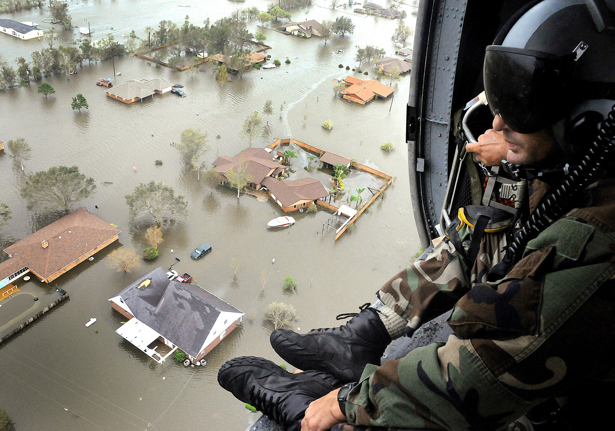 An Air Force Reserve pararescueman from the 920th Rescue Wing scans the landscape of Nederland, Texas in the aftermath of Hurricane Ike, Sept. 13,&nbsp;2008.
