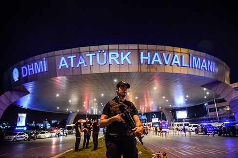 Police patrol Ataturk airport in Istanbul.