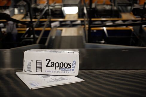 A Zappos package moves down a conveyor belt at a UPS facility.