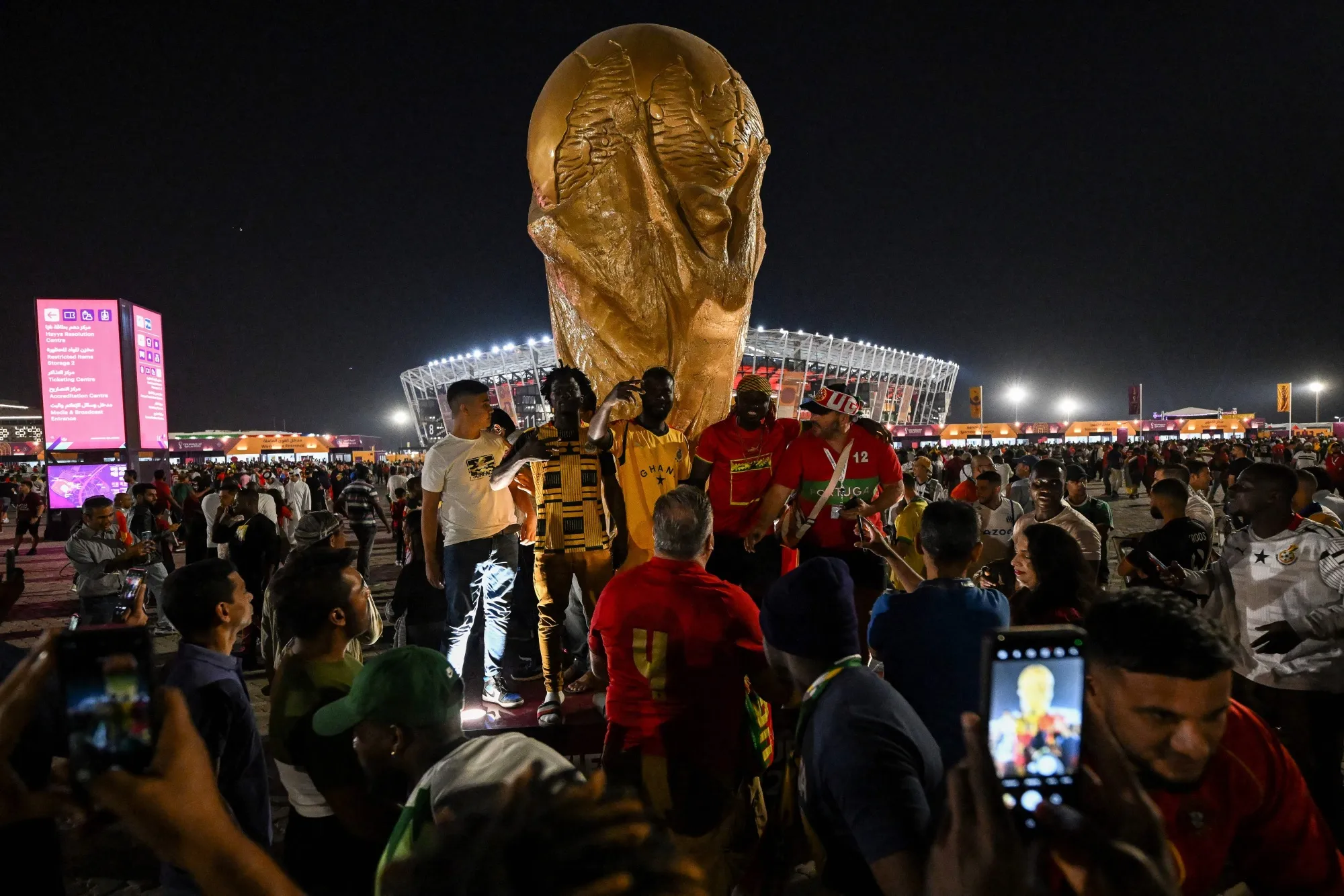 Ghana and Portugal football fans gather outside of Stadium 974 in Doha.