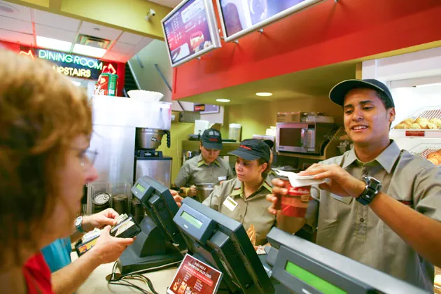 Customers order coffee in a Tim Hortons coffee and bake shop in New York City