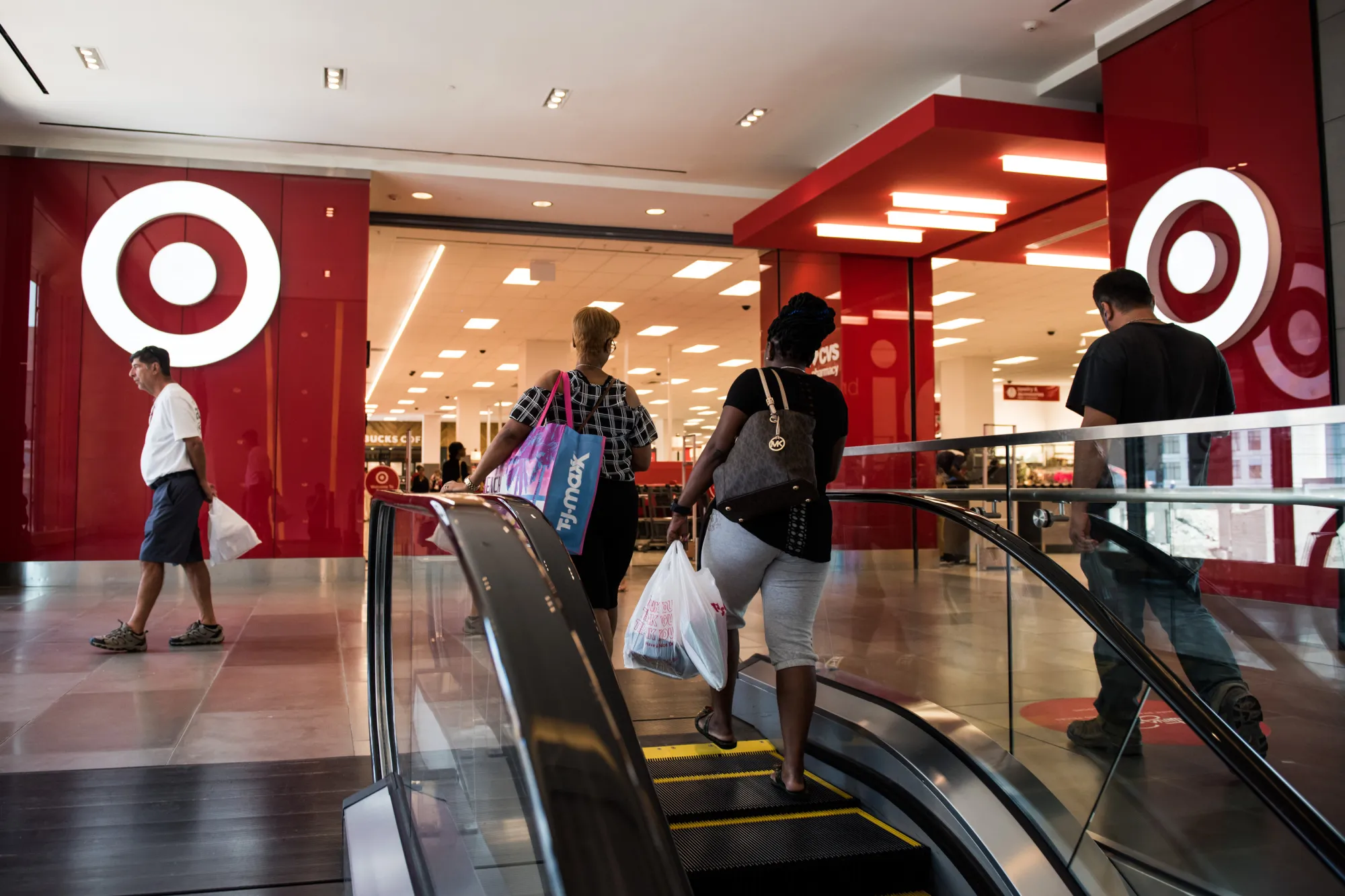 Shoppers walk towards a Target store in New York.