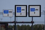 Signs hang above passport controls at the Imatra border between Finland and Russia.