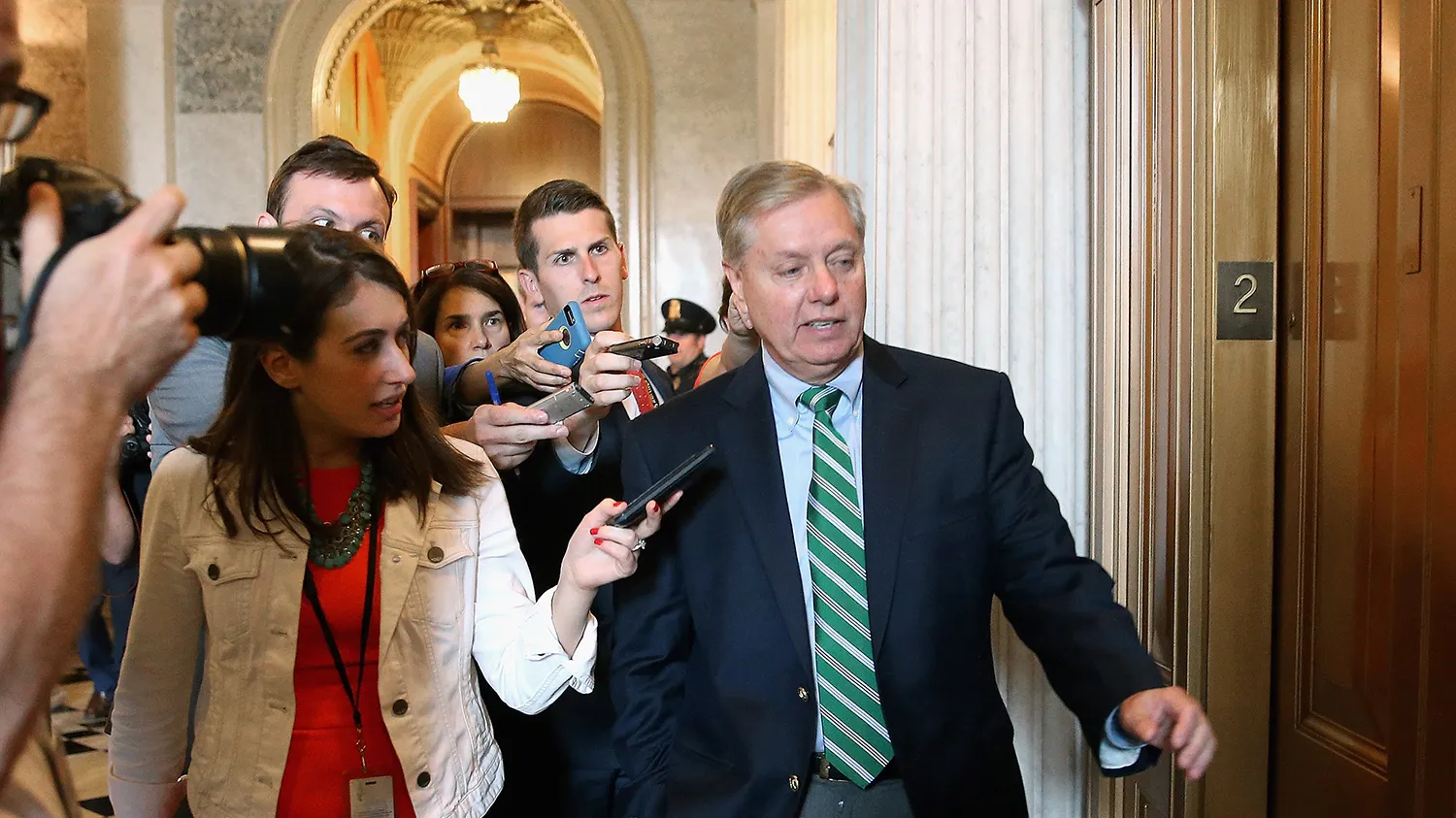 Republican presidential candidate Sen. Lindsey Graham (R-SC) is pursued by reporters following the weekly Democratic Senate policy luncheon at the U.S. Capitol June 23, 2015 in Washington, DC.
