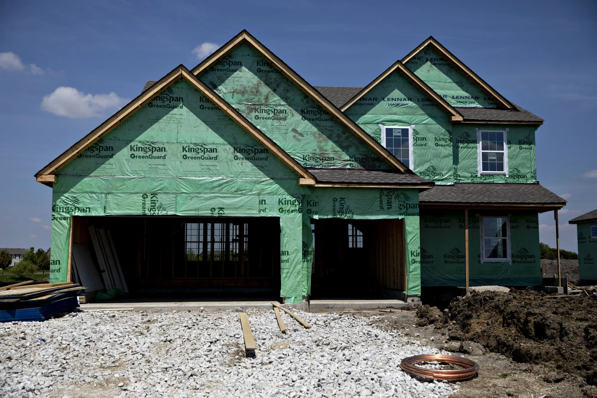 A new home stands under construction at a Lennar Corp. development in Montgomery, Illinois.