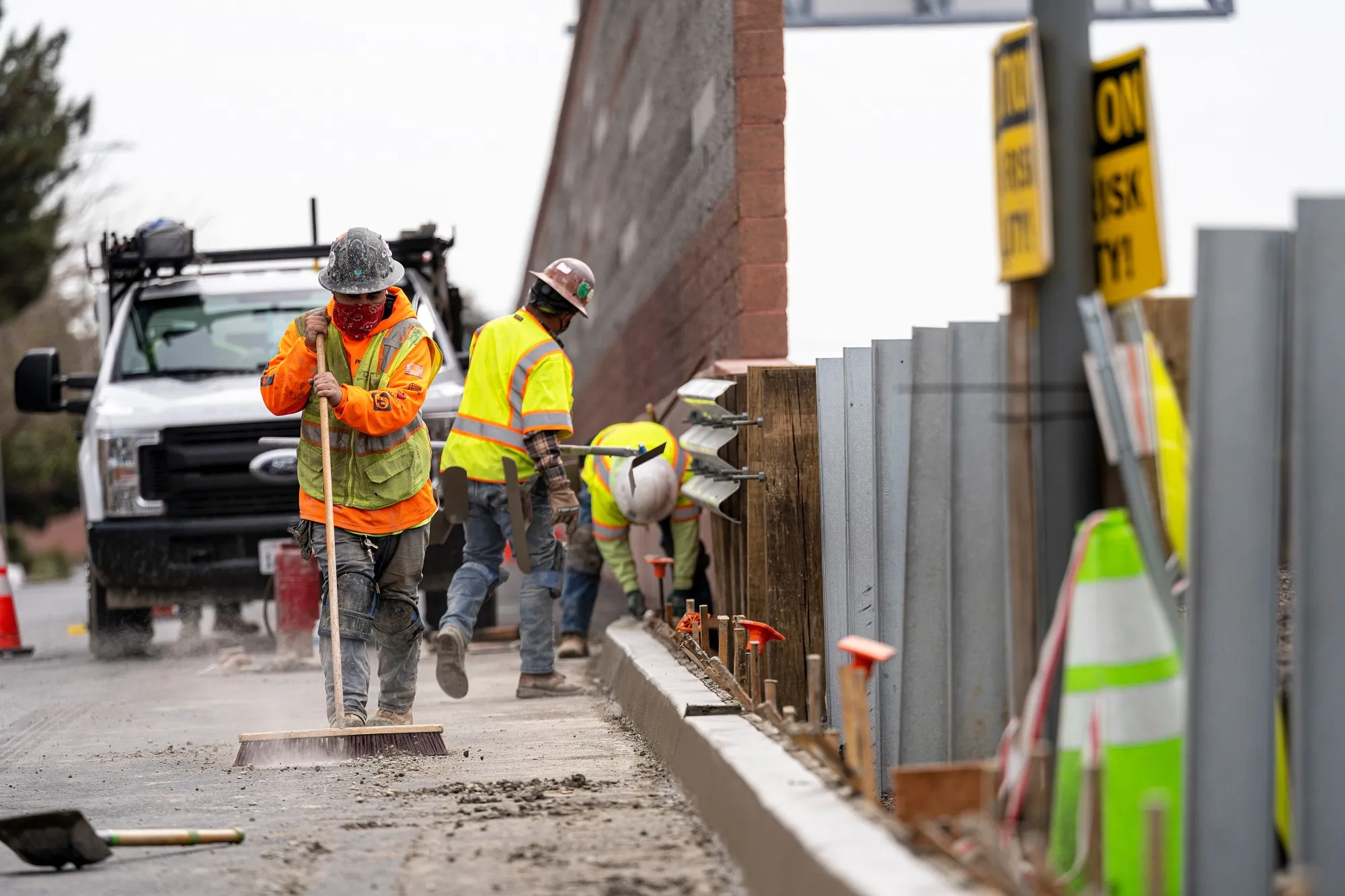 Contractors work on a road under repair in San Mateo, California.