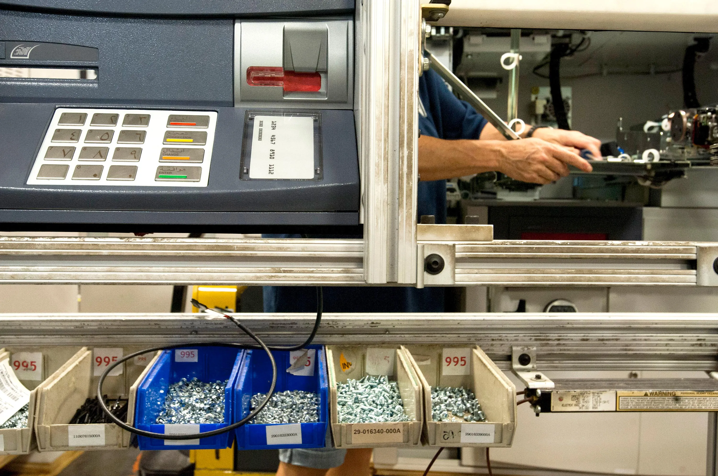 An ATM being manufactured in Greensboro, North Carolina, on July 16, 2013. Criminals are stealing people's payment card information by tampering with ATM PIN pads. Photographer: Ty Wright/Bloomberg