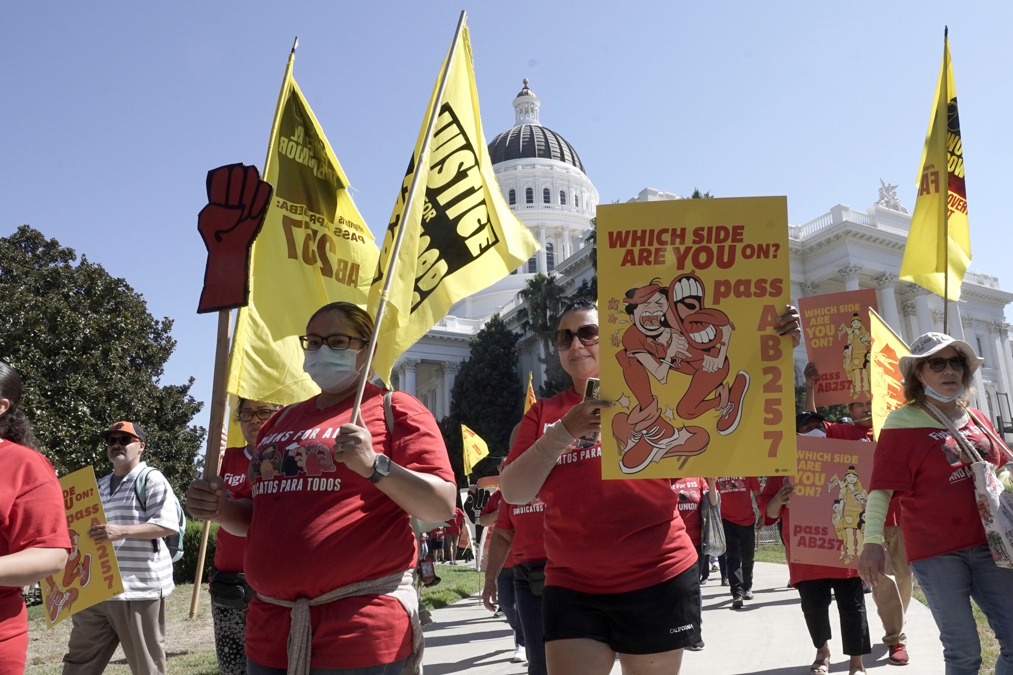 Supporters of the bill march outside the state Capitol&nbsp;in Sacramento, on Aug. 16.&nbsp;