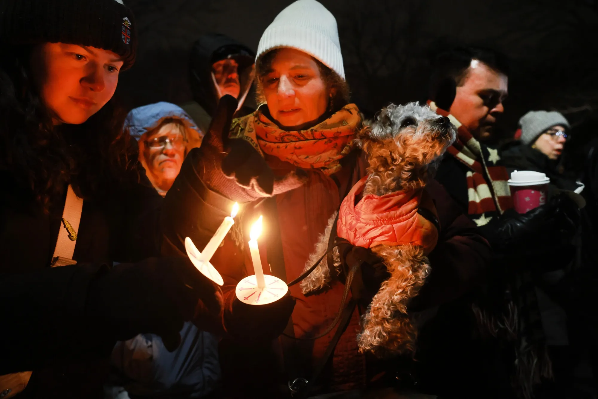 People gather for a candlelight vigil at Brown University on Dec. 14.