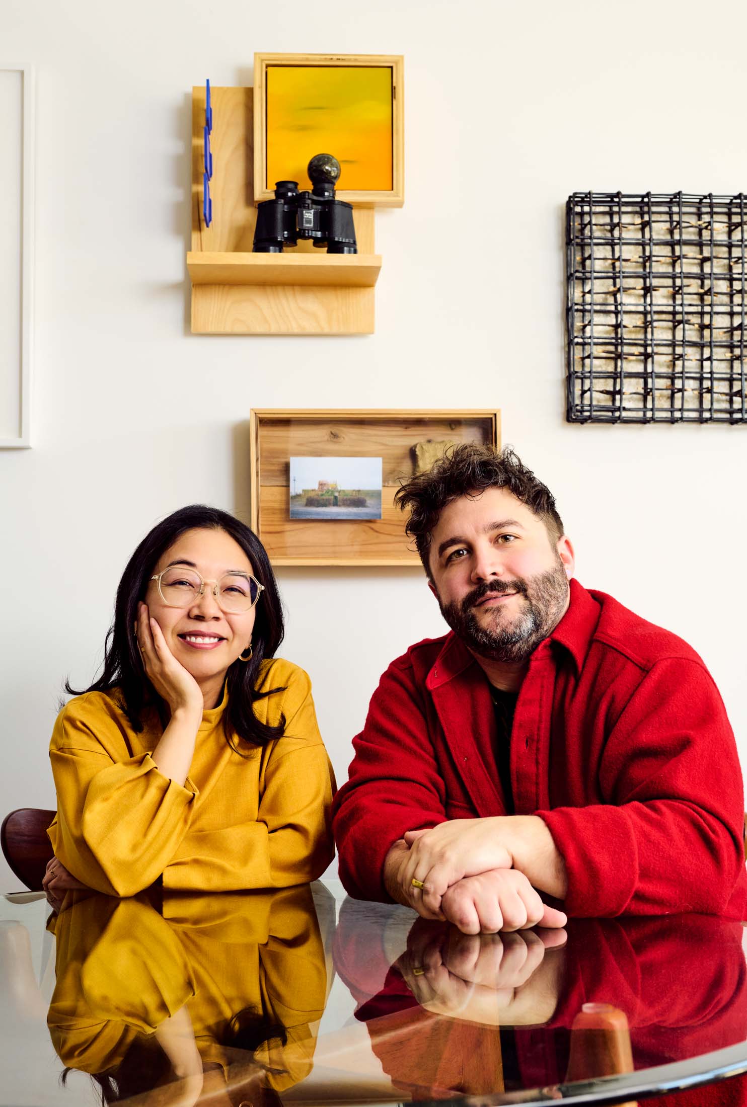 Collector Yayoi Shionoiri and artist Bob Szantyr in front of the piece of his she found at ZAF (top left). Photographer: Mackenzie Stroh for Bloomberg Businessweek